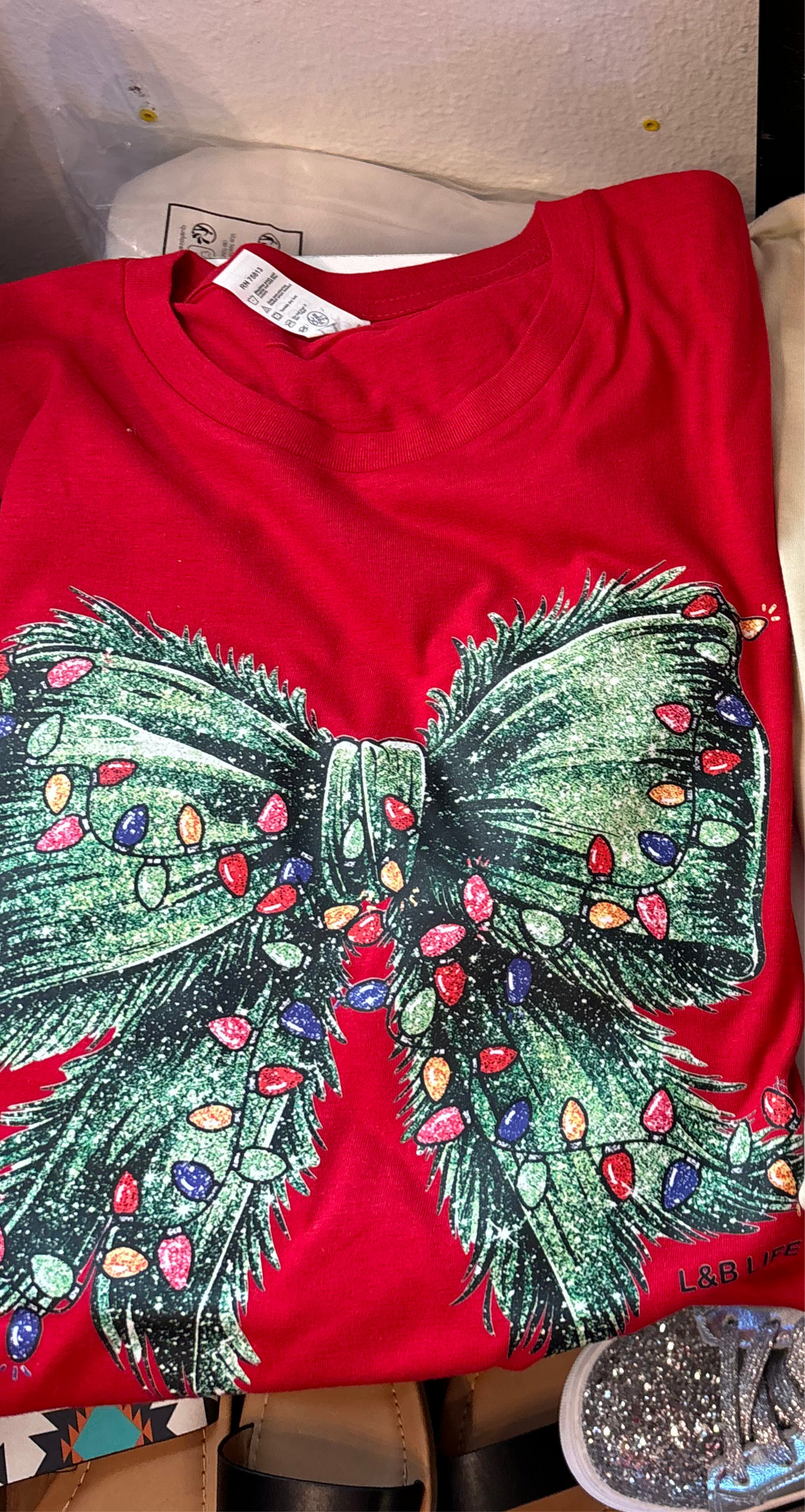Red Graphic Tee with Green Bow and Christmas Lights