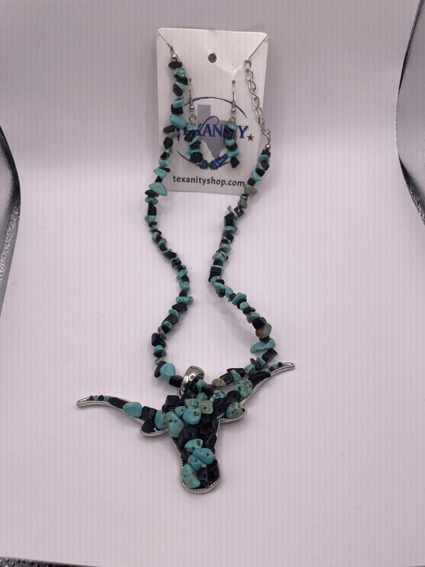 Black and Turquoise Stone Necklace with Cow Skull